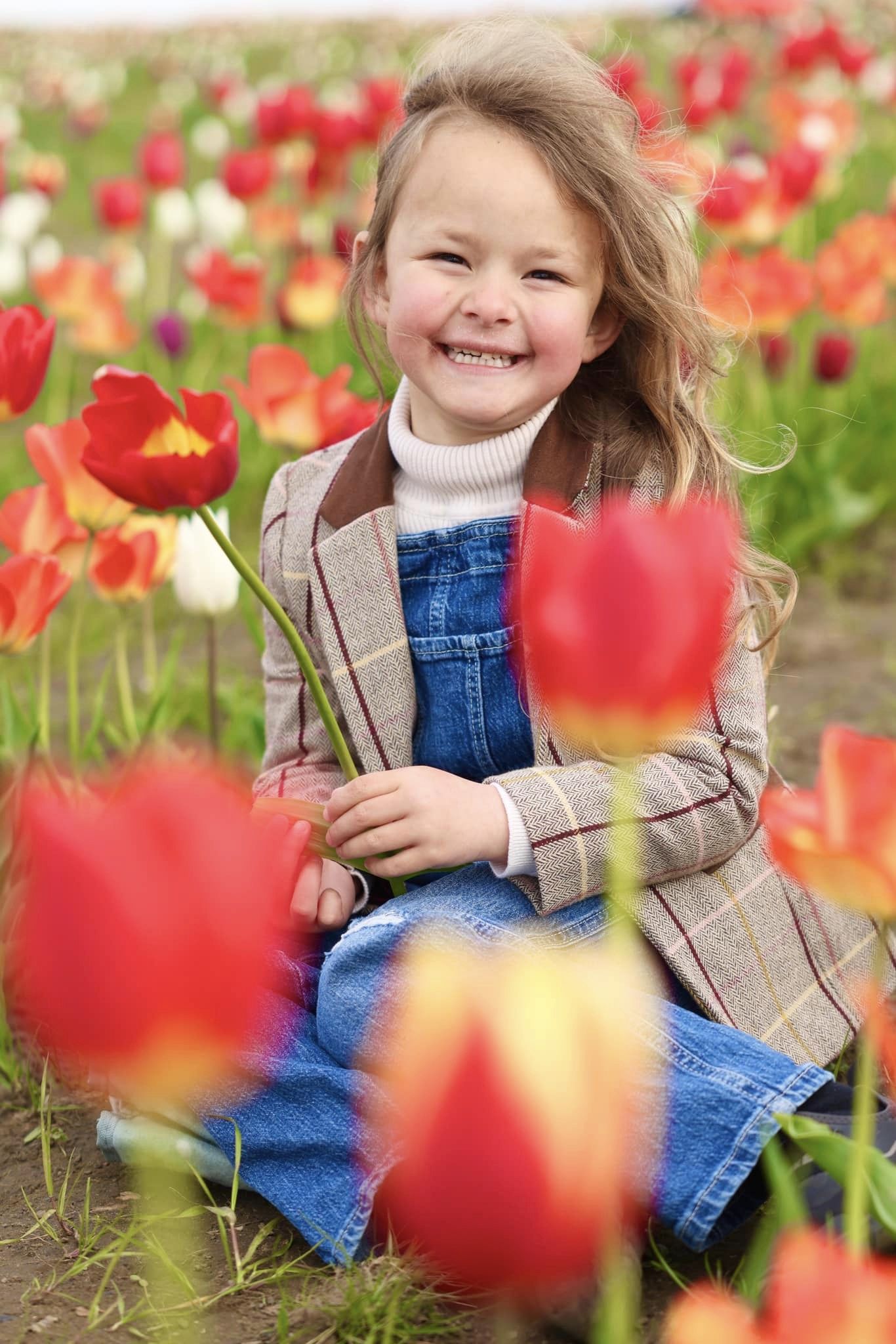 siling girl in a tulip field